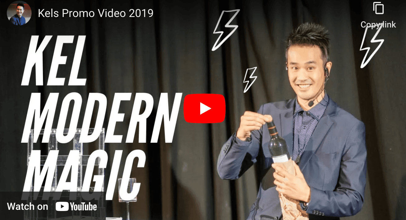 Title card from Kel Modern Magic's 2019 promo video, with Kel performing on stage