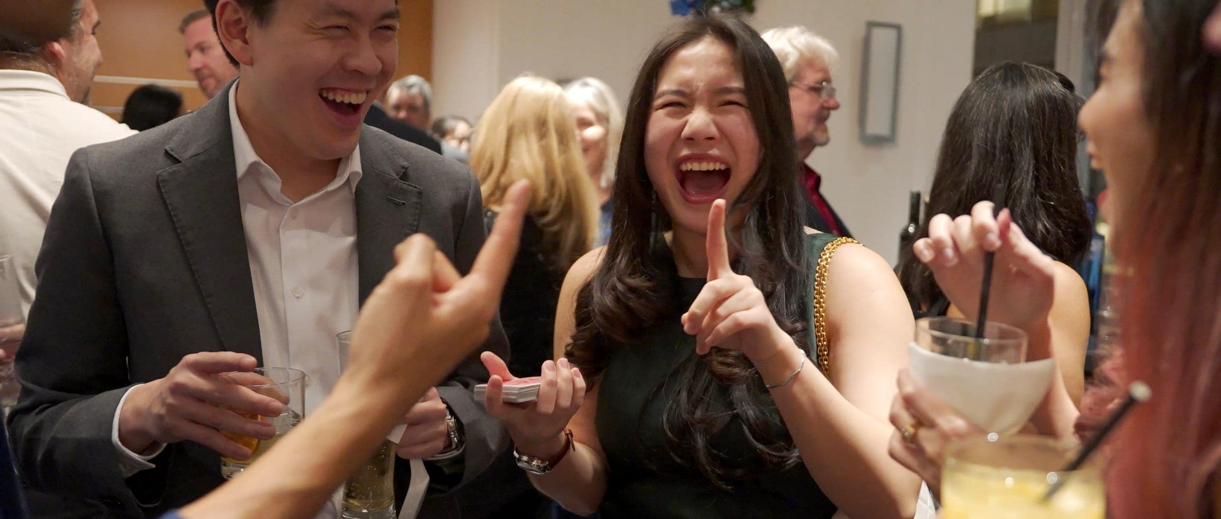 A guest cheering with both thumbs up at Endeavour Silver's Christmas party at the Hyatt Regency Vancouver