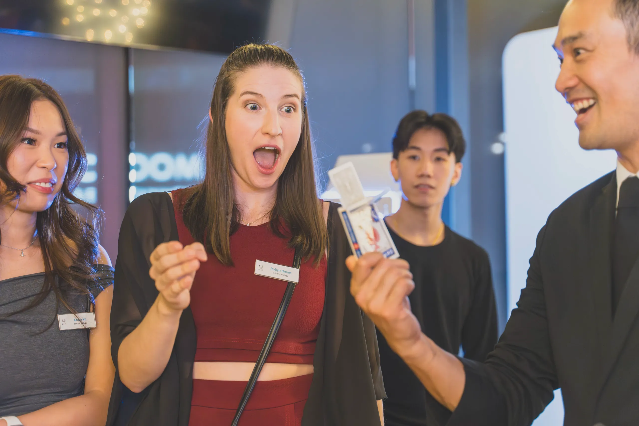 Corporate guest reacting with disbelief during close-up magic at a Vancouver event