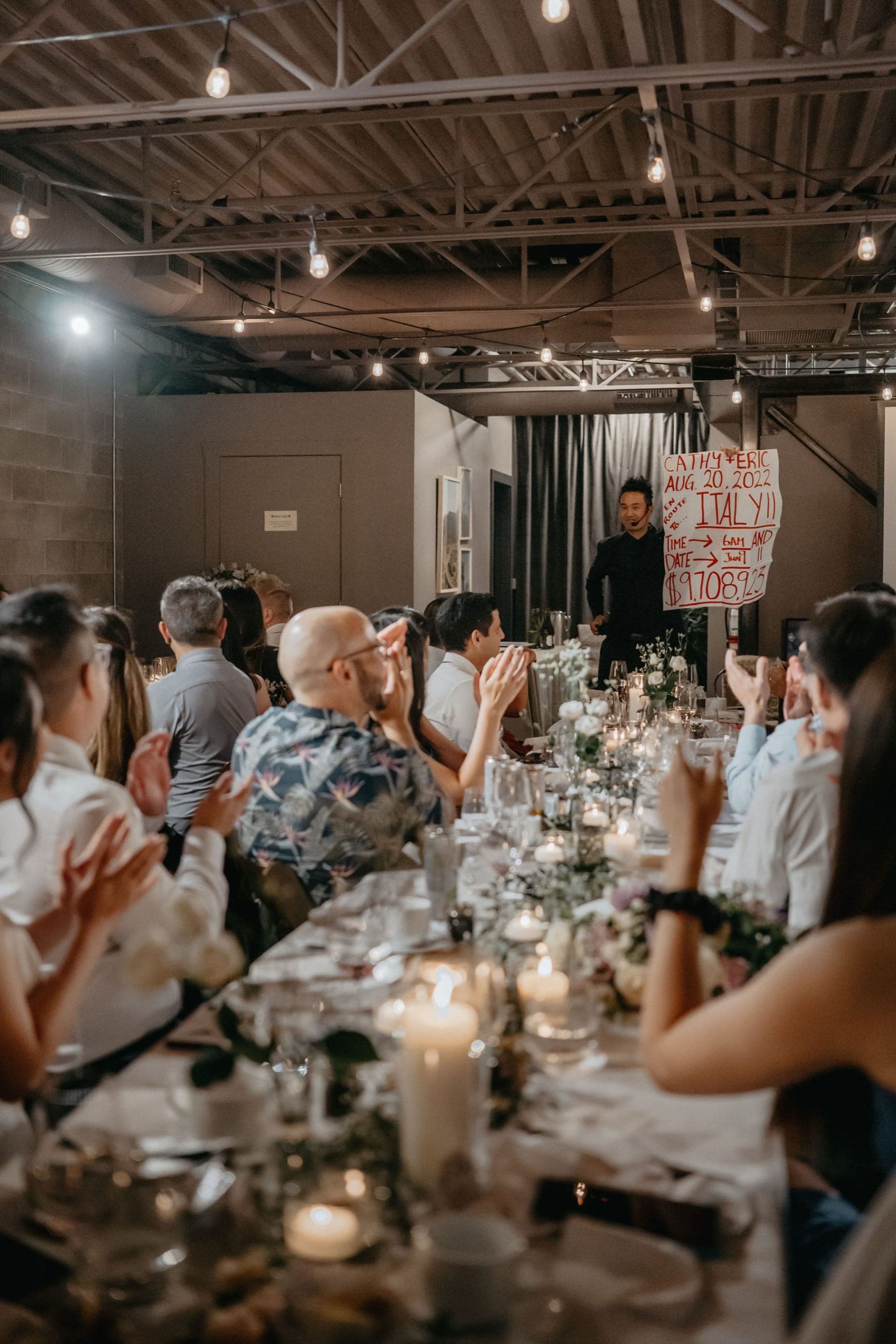 A prediction reveal during Cathy and Eric's wedding reception in Vancouver